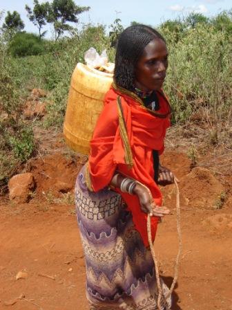 Borana woman carrying water
